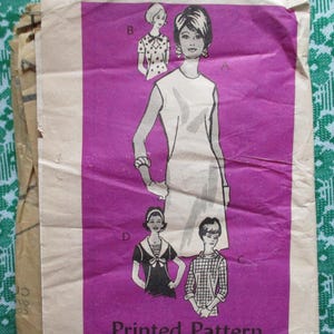 May include: Vintage printed sewing pattern featuring illustrations of women's fashion designs. The pattern is on a purple background with the words "Printed Pattern" at the bottom. The illustrations depict various dress styles and tops.