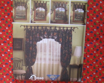 May include: A window treatment pattern guide featuring a set of curtains with a valance. The curtains are a dark green and brown floral print with a sheer white curtain behind them. The valance is a matching floral print. The guide also shows close-up details of the valance in different window styles. The text on the guide reads "Tremendous by Conso" and "Javas 1994".