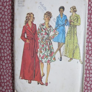 May include: A sewing pattern envelope labeled X Large 38-40 featuring illustrations of four robe styles. The designs include a long red robe with white trim, a knee-length floral robe, a short blue robe with a belt, and a long yellow patterned robe.