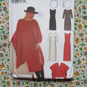 May include: A sewing pattern featuring a woman wearing a red cape-like dress with a high slit, and a black hat. The pattern also shows illustrations of several dress designs. The background is a patterned fabric.