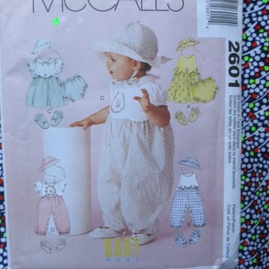 Vintage 2000s McCalls sewing pattern 2601 Infants spring wardrobe dresses hats rompers shoes and panties UNCUT size S-XL
