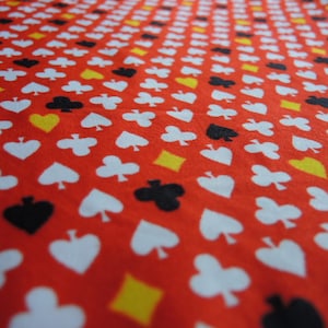 vintage silky stretch knit fabric red with clubs spades hearts and diamonds 44 inches wide