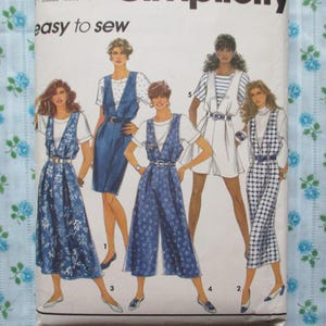 May include: A sewing pattern featuring five different styles of jumpsuits. The pattern is titled "Simplicity" and includes the phrase "easy to sew".