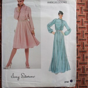 May include: A sewing pattern for a dress with a ruffled neckline and long sleeves. The pattern is for sizes 6-14 and is by Jerry Silverman, an American designer. The pattern number is 2782.