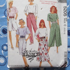 May include: A vintage sewing pattern envelope with illustrations of women's clothing designs. The designs include a striped top and shorts, a long-sleeved top and trousers, a polka dot jumpsuit, and a floral skirt. The text "Fashion Basics" is visible.