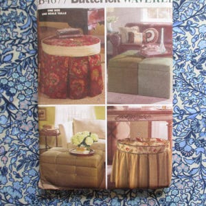 May include: A vintage sewing pattern featuring images of upholstered ottomans. The pattern shows various styles, including a round ottoman with a floral skirt and a rectangular, button-tufted ottoman. The color palette includes reds, greens, and golds.