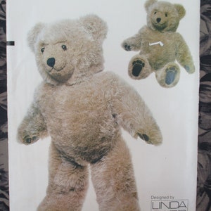 May include: A pattern for a large, brown teddy bear with a simple design. The pattern includes instructions for making a smaller teddy bear as well. The pattern is designed by Linda.