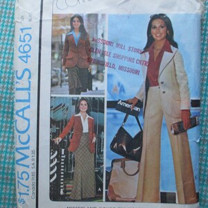 May include: A vintage McCall's sewing pattern for a women's pantsuit. The pattern is for size 4651 and costs $1.75. The pattern shows a woman wearing a white pantsuit with a red blouse and a brown handbag. The pattern also shows a woman wearing a brown blazer with a blue blouse and a brown skirt. The pattern is from Missouri Mill Store, Glen Isle Shopping Centre, Springfield, Missouri.