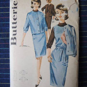 May include: A vintage sewing pattern featuring two women's outfits. The pattern includes a short-sleeved jacket and skirt, and a long-sleeved jacket and skirt. The pattern is printed on white paper with black text and illustrations.