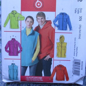 May include: A sewing pattern for a hooded jacket and vest. The pattern includes instructions for making a jacket with a zipper closure and a vest with a zipper closure. The pattern is available in sizes XN (X-Large, XX-Large, XXX-Large).