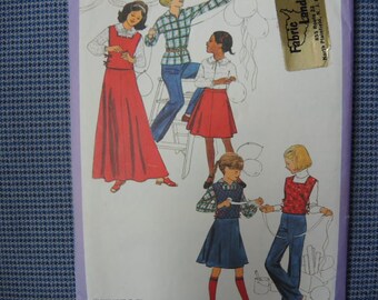 vintage 1970s Simplicity sewing pattern 8219 girls skirt in two lengths,  tabard,  pants and pullover blouse