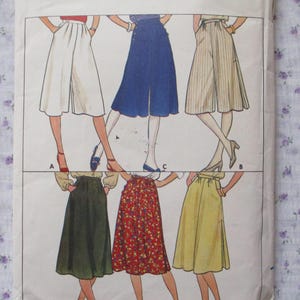 May include: A sewing pattern for five different skirt styles. The skirts are shown in various colors and fabrics, including white, blue, beige, green, and red. The pattern includes instructions for making each skirt.