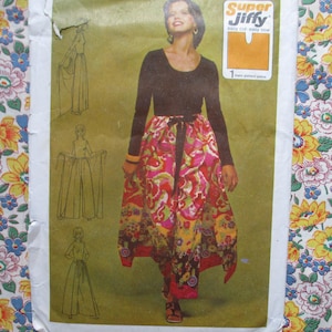 May include: A vintage sewing pattern featuring a woman wearing a long-sleeved black top and a colorful wrap skirt with a floral design. The pattern includes sketches of the garment and the text "Super Jiffy".