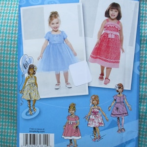 2000s sewing pattern Simplicity Project Runway 1814 girls&#39; dress in two lengths with bodice and trim variations UNCUT size 4-8