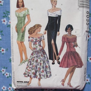 May include: A vintage sewing pattern with illustrations of four off-the-shoulder dresses. The dresses include a green sheath dress, a black gown with a white top, a floral print dress, and a red dress with a flared skirt.