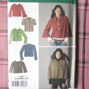 May include: A sewing pattern for a jacket with different styles. The pattern includes a red jacket, a green jacket, a blue jacket, a brown jacket, and a plaid jacket. The pattern is from Simplicity.com.
