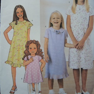 May include: A sewing pattern for three girls' dresses. The dresses are all floral print and have short sleeves. The pattern includes instructions for making the dresses.