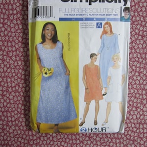 May include: A Simplicity sewing pattern envelope for a dress with full figure solutions. The cover features a blue and white checkered dress, a solid orange dress, a solid light blue dress, and a solid white dress, all with scoop necklines.