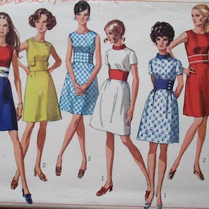 May include: A vintage sewing pattern featuring five women wearing different styles of short dresses. The dresses are in various colors and patterns, including red, blue, white, yellow, and checkered. The pattern is labeled "Miss 10 Size 10 Bust 32 1/4 New Sizing".