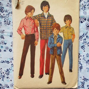 May include: A vintage sewing pattern featuring four boys wearing different clothing styles. The pattern includes a plaid shirt, a striped shirt, a solid shirt, and a jacket. The pattern is printed on a white background with a floral pattern border.