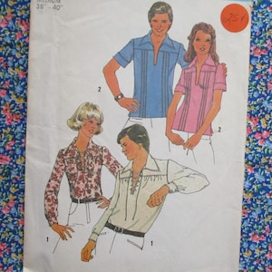 May include: A vintage sewing pattern with illustrations of shirts. The designs include a blue short-sleeved shirt with vertical stripes, a pink striped shirt, a floral print shirt, and a white shirt with a lace-up front. The pattern is for a medium size.