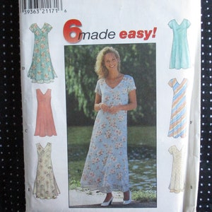 May include: A sewing pattern for six different dresses. The pattern includes a long floral dress, a short floral dress, a short pink dress, a short striped dress, a short cream dress, and a short blue dress. The pattern is titled "6 made easy!"