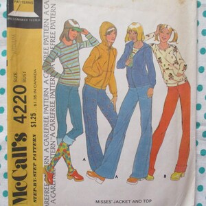 May include: Vintage McCall's sewing pattern 4220 featuring illustrations of four women in jackets and tops with jeans and pants. The pattern includes the text "Misses' Jacket and Top" and "Step-by-Step Pattern". The pattern is on a white and teal polka dot background.