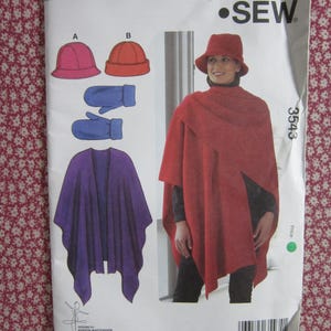 May include: A sewing pattern envelope labeled SEW 3543 featuring illustrations and a photograph of a red poncho, a red bucket hat, and blue mittens. The pattern includes two hat styles, mittens, and a draped poncho design for cold weather clothing.