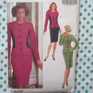 May include: A vintage sewing pattern showing a woman in a pink suit with black detailing. The pattern includes illustrations of the suit in various colours, including pink, black, and green. The pattern is for a jacket and skirt.