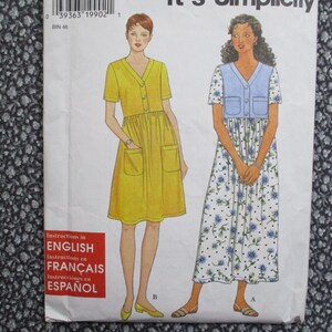 May include: A vintage sewing pattern featuring illustrations of two dresses. One is a yellow dress with pockets and buttons, the other is a floral print dress with a blue vest. The pattern includes instructions in English, French, and Spanish.