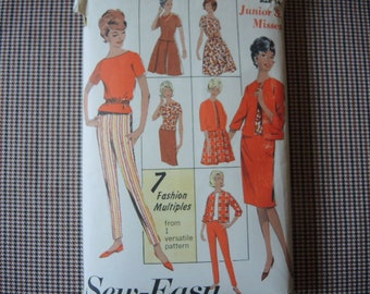 May include: Vintage sewing pattern featuring seven fashion multiples from one versatile pattern. The pattern is for junior and misses sizes and features a red, white and yellow striped pantsuit, a red skirt and jacket, and a red and white patterned skirt and jacket.