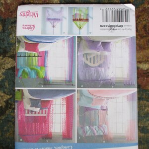 May include: A sewing pattern for a canopy bed with four different styles of curtains. The curtains are made of sheer fabric and are available in pink, purple, and blue. The pattern is from Simplicity and the pattern number is 5969 62772.
