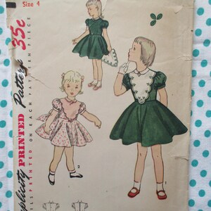 May include: Vintage Simplicity pattern for a size 4 girl's dress. The illustration shows three girls in dresses, with a green dress and a pink floral dress. The price is marked as 35 cents.