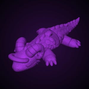 Op de afbeelding: Een massief paars, driedimensionaal beeldje van een wezen dat lijkt op een draak of reptiel. Het figuur heeft gekrulde hoorns op de kop, een getextureerd lichaam met schubben en een lange, puntige staart in een rustende houding.