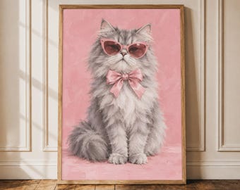 May include: A framed wall art print featuring a fluffy grey cat wearing pink cat-eye sunglasses and a matching pink bow tie. The cat is centered against a solid, textured pink background, captured in a portrait style with soft, painterly brushstrokes.