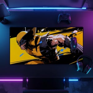 May include: A rectangular desk mat featuring a graphic illustration of the character Wolverine in his yellow and black suit. The artwork displays a dynamic action pose with sharp claw details against a bold yellow and black background.