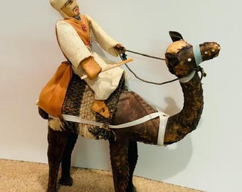 Folk art leather camel with Bedouin