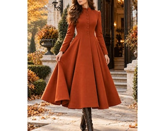 May include: A long-sleeved, floor-length coat in a solid burnt orange color. The coat features a high mandarin collar, a fitted bodice with a row of matching buttons down the center front, and a full, flared skirt that reaches the ankles.