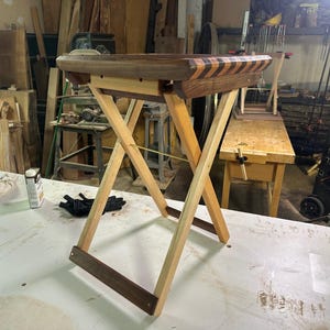 May include: A set of three ceramic mugs with a speckled, matte finish. The mugs are in shades of cream, light gray, and dark gray. Each mug has a simple, minimalist design, perfect for coffee or tea.