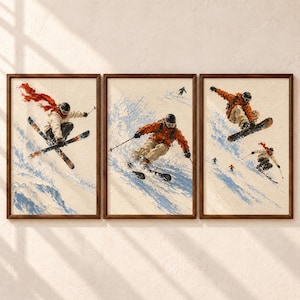 Könnte beinhalten: Ein Triptychon aus drei gerahmten Ölgemälden mit Wintersportmotiven. Das erste zeigt einen Skifahrer beim Sprung mit rotem Schal. Das zweite zeigt einen Skifahrer im Schnee. Das dritte zeigt einen Snowboarder in der Luft und einen Skifahrer.