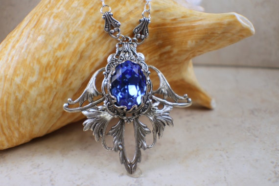 Blue and White Filigree Flower Crystal Medallion Necklace Blue and White Filigree Flower Crystal Medallion Necklace