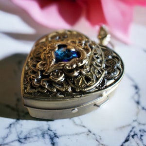Heart music box locket, heart shaped locket with music box inside, in bronze with blue crystal heart.