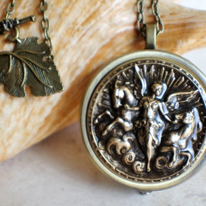 Music box locket, round locket with music box inside, in bronze with angel and horses medallion. image 6