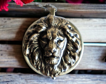 Lion music box locket,  round locket with music box inside, in bronze with lion.