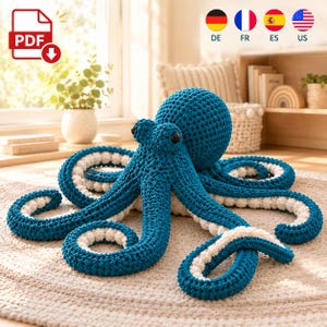 May include: A large, handcrafted crochet octopus toy featuring a deep blue exterior and a textured white underside on its eight tentacles. The octopus has a round head and two dark, round eyes. It is positioned on a circular, light-coloured rug.