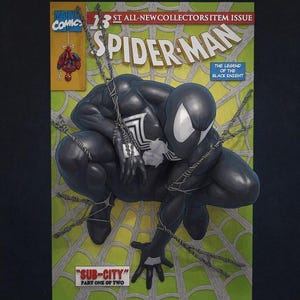 May include: A Marvel Comics Spider-Man issue 13 comic book featuring a black-suited character crouching on a light green spiderweb background. The cover includes the text 1ST ALL-NEW COLLECTORS ITEM ISSUE, THE LEGEND OF THE BLACK KNIGHT, and SUB-CITY.
