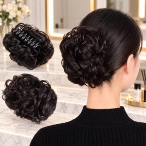 May include: A dark brown hair extension piece styled as a messy bun with a claw clip attachment. The synthetic hair features tight, voluminous curls and is shown both as a standalone accessory and attached to hair to create a full, rounded bun.