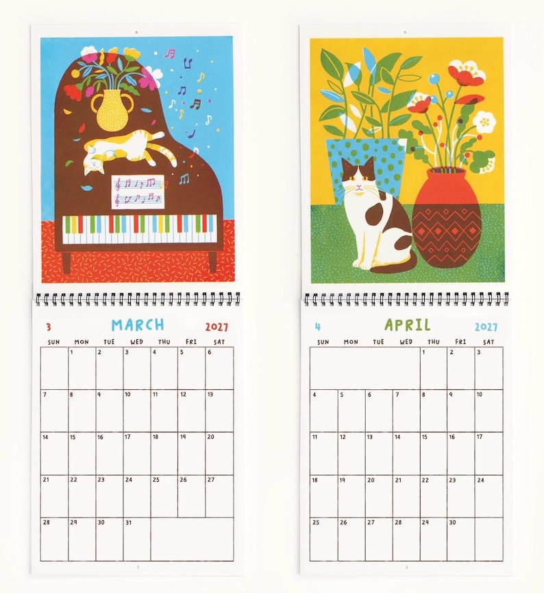 May include: A wall calendar showing March and April 2027. The March page features a brown piano with a cat, a vase of flowers, and musical notes. The April page shows a cat sitting next to a red vase of flowers and a green potted plant.
