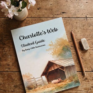 May include: A paperback book titled Charlotte's Web Student Guide by Busy Little Bookworm, featuring a watercolor illustration of a pig in a barn, a wooden fence, and spiderwebs, accompanied by a wooden pencil and a rectangular eraser.