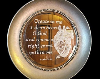 Round mirror etching of anatomical heart and scripture.